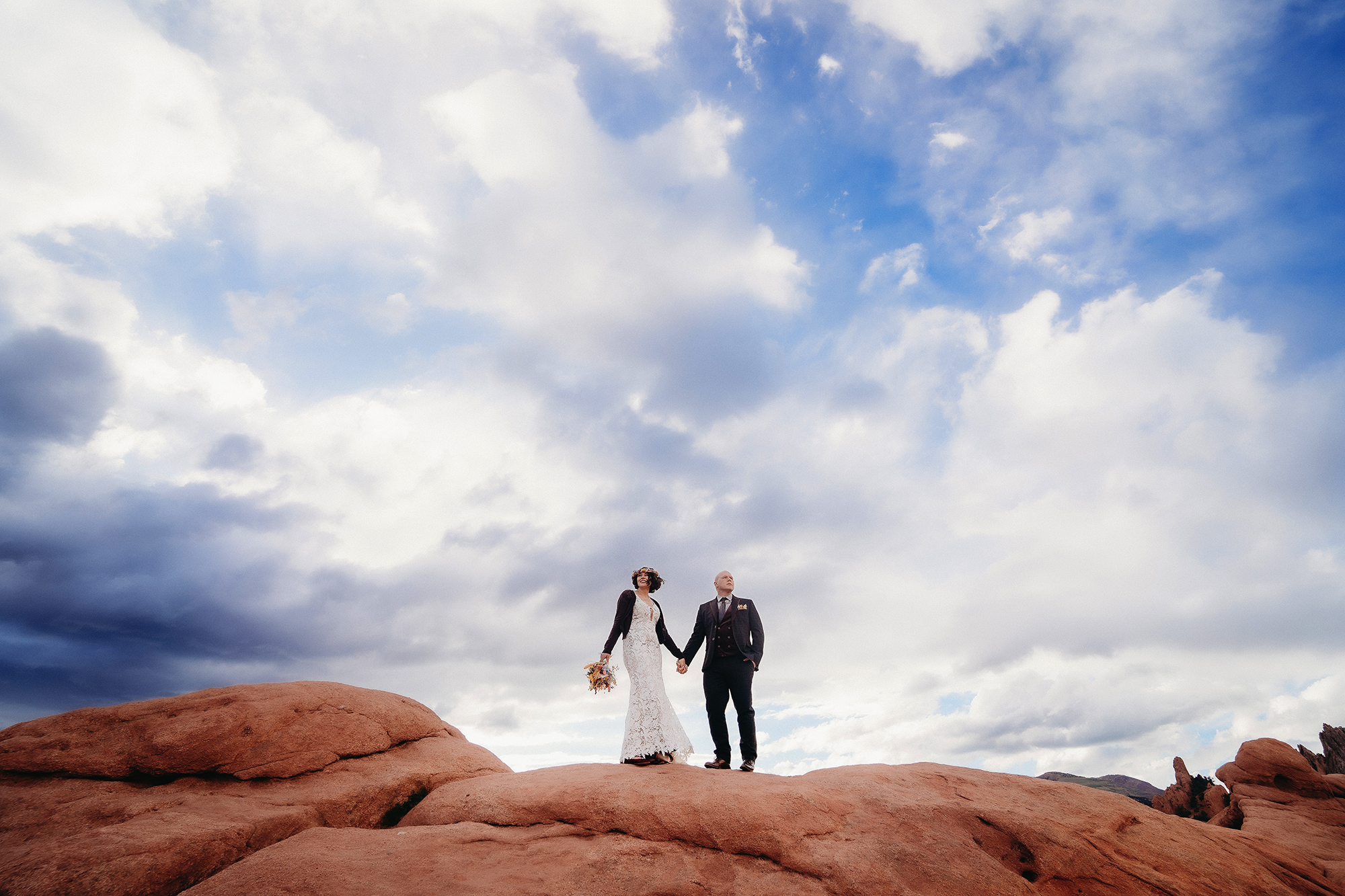 Denver Wedding Photographer captures bride and groom holding hands during bridals after british chic garden of the gods elopement