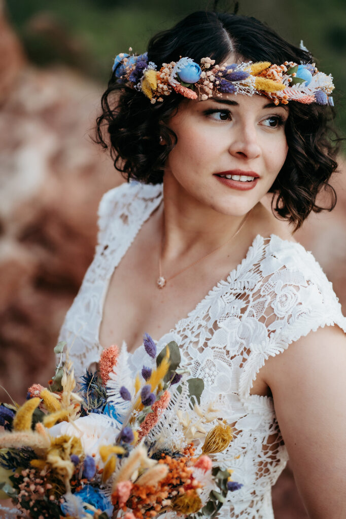 Denver Wedding Photographer captures bride wearing floral crown and holding bouquet