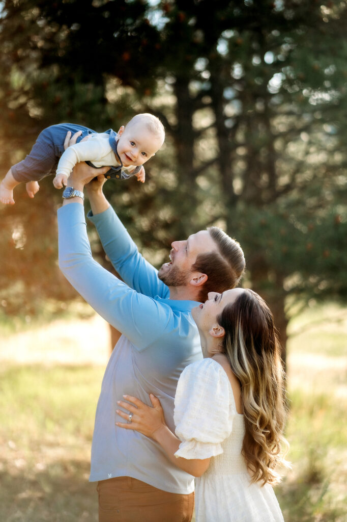 Colorado Family Photographer captures father lifting up son during outdoor family photos