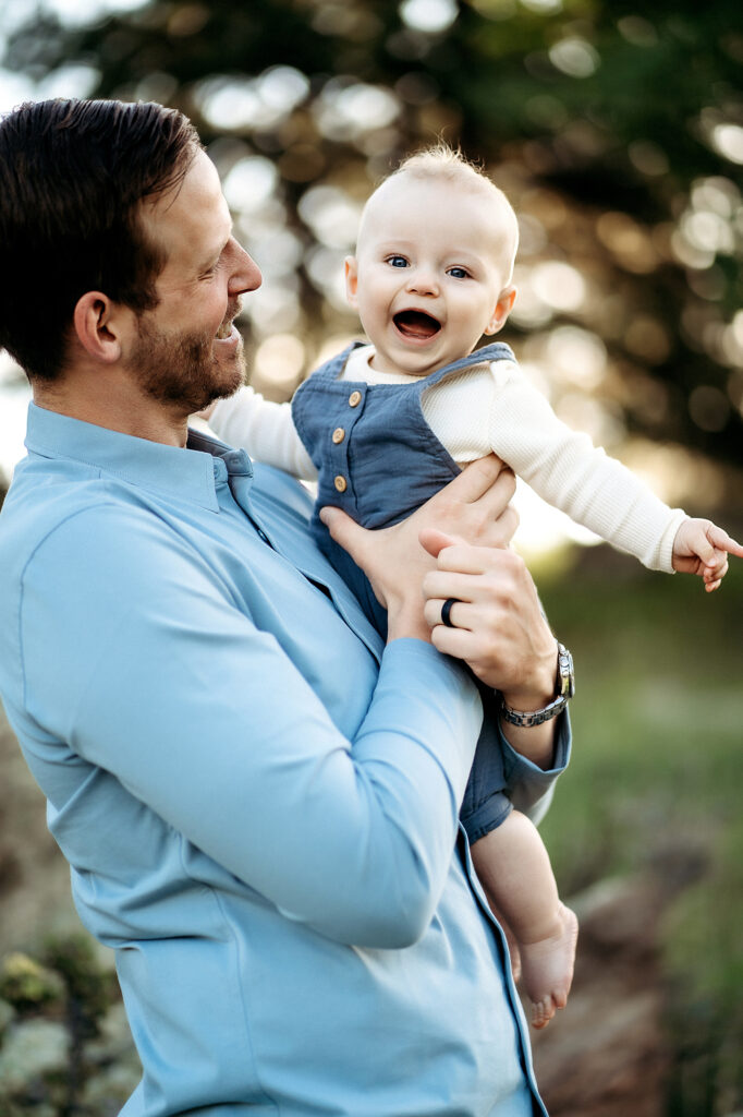 Denver Family Photographers capture father holding son and making him laugh