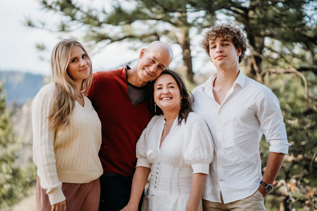 Denver Family Photographer captures family standing together during outdoor family photos