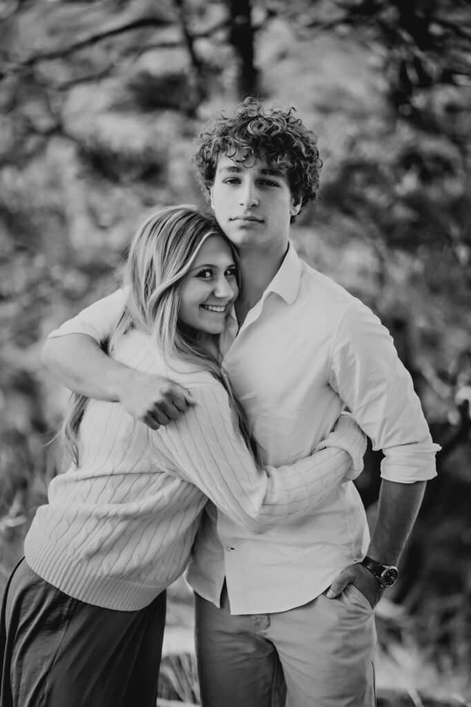 Denver Family Photographer captures brother hugging sister during outdoor family photos