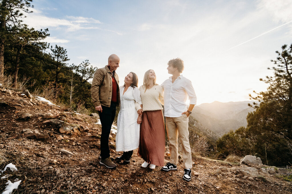 Denver Family Photographers capture family standing together on top of mountain