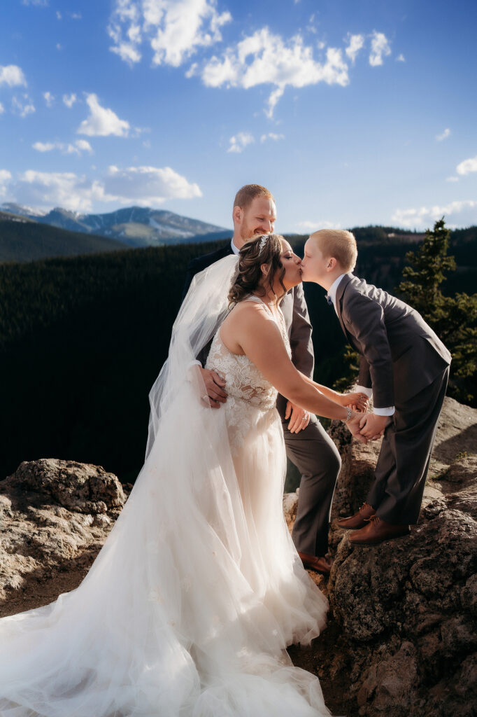 Colorado Elopement Photographer captures son kissing mother