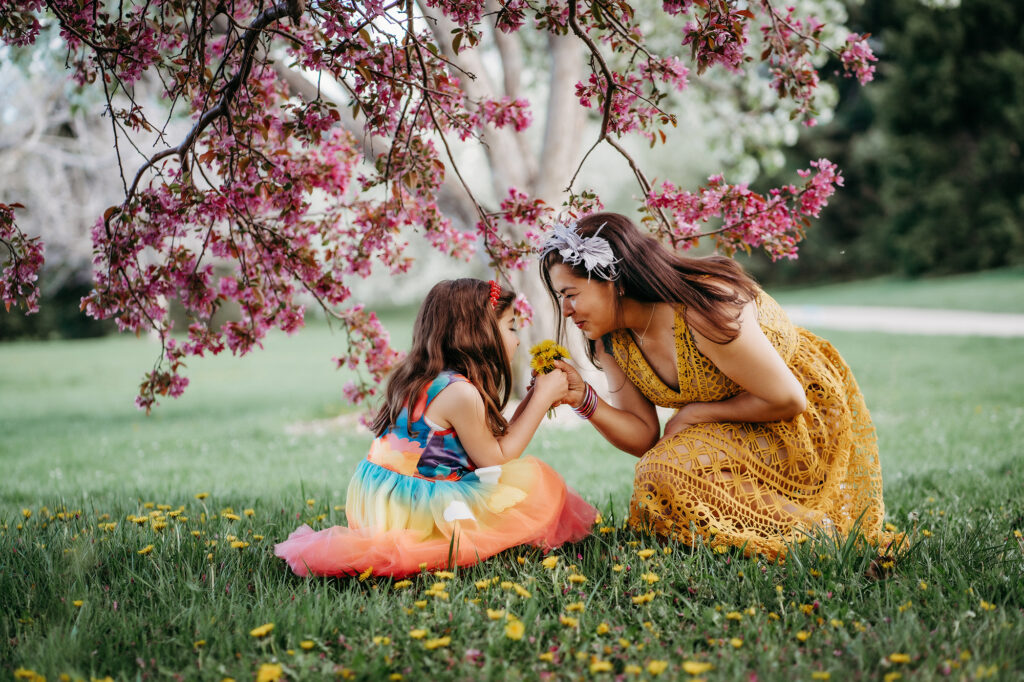 Denver Family Photographer captures mother and daughter playing in flowers together during mini session