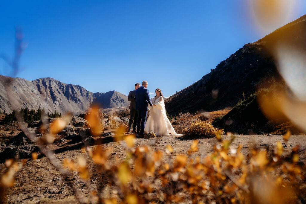 Colorado Elopement Photographer captures bride and groom during outdoor wedding ceremony