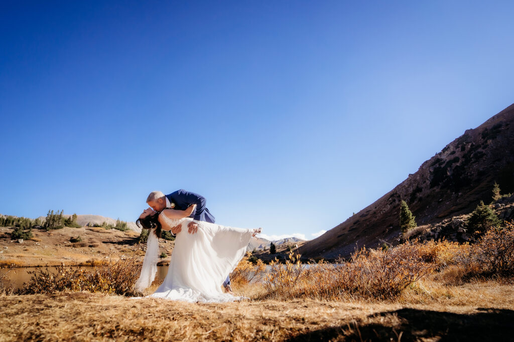 Colorado Elopement Photographer captures dip kiss between bride and groom during Denver elopement