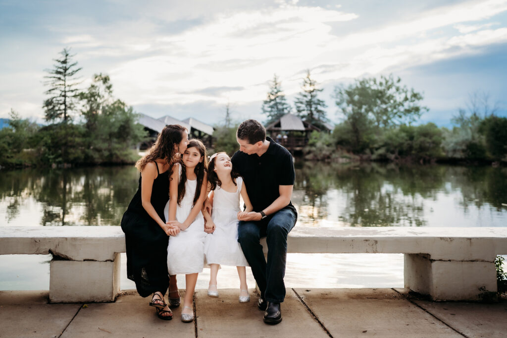 Denver Family Photographer captures family sitting together and laughing