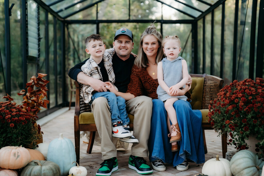 Denver Family Photographer captures young family sitting together on couch 