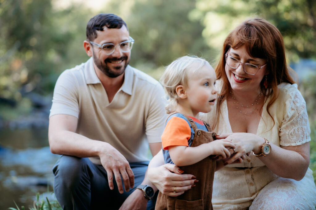 Denver Family Photographer captures mother and father with young child during outdoor family photos