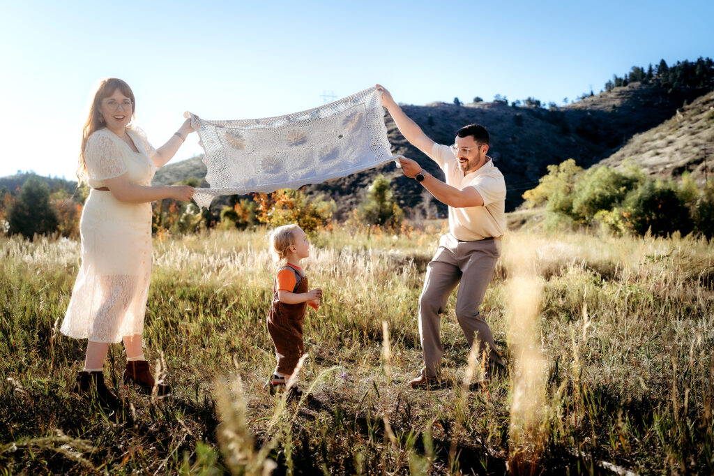 Denver Family Photographer captures mother and father playing with baby 