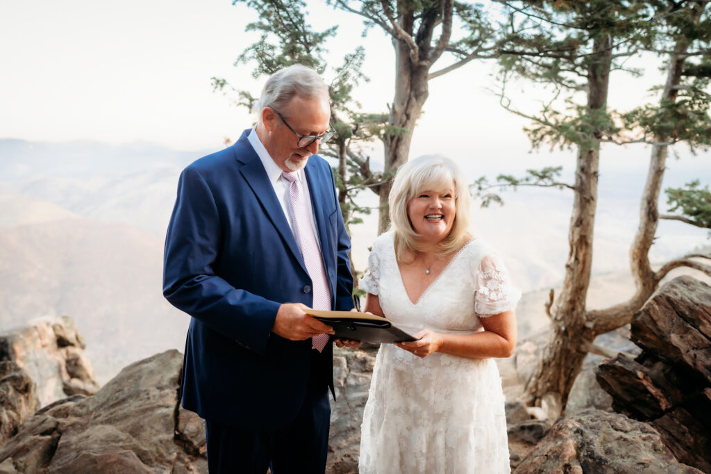 Colorado Elopement Photographer captures bride and groom signing marriage license after elopement ceremony in Colorado