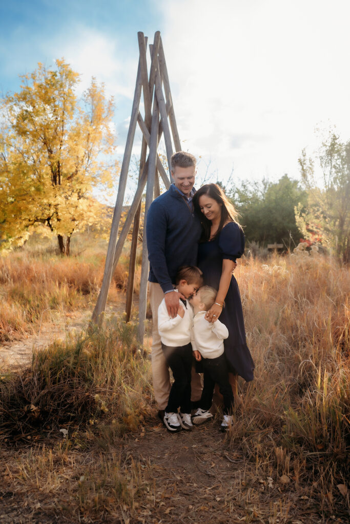 Denver Family Photographer captures family standing together during outdoor family photos Denver Colorado