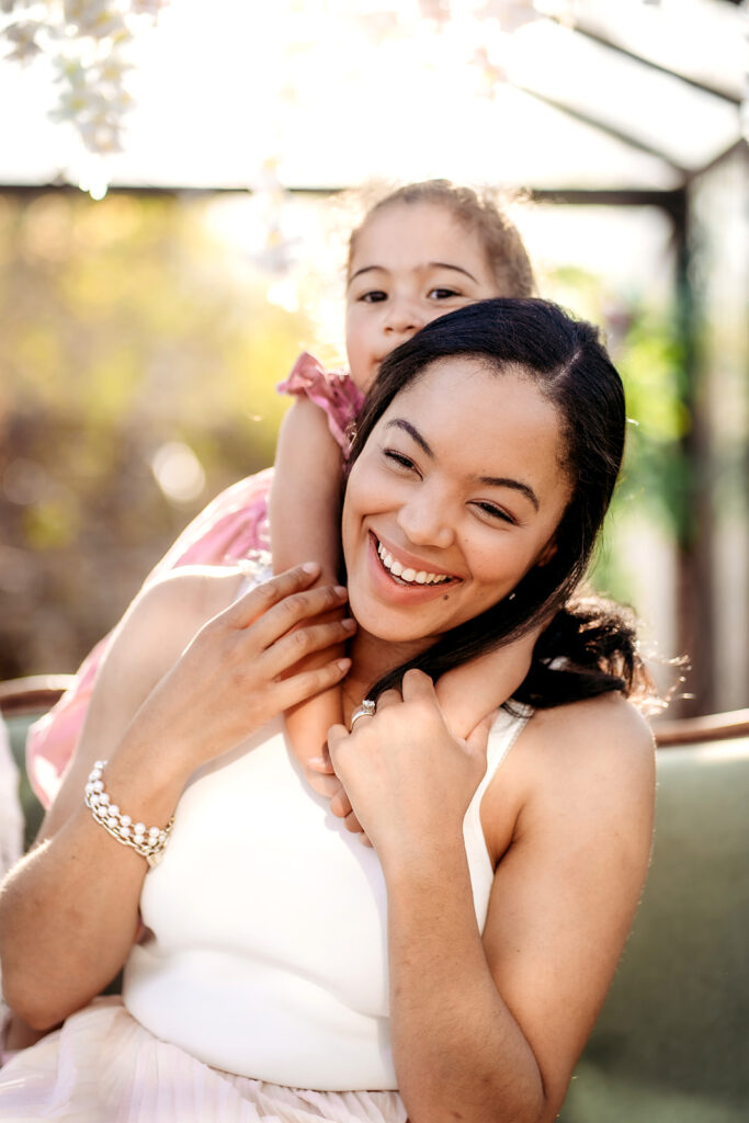 Denver Family Photographer captures child with arms around mother's neck