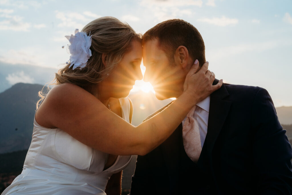 Colorado Elopement Photographer captures couple embracing at sunset