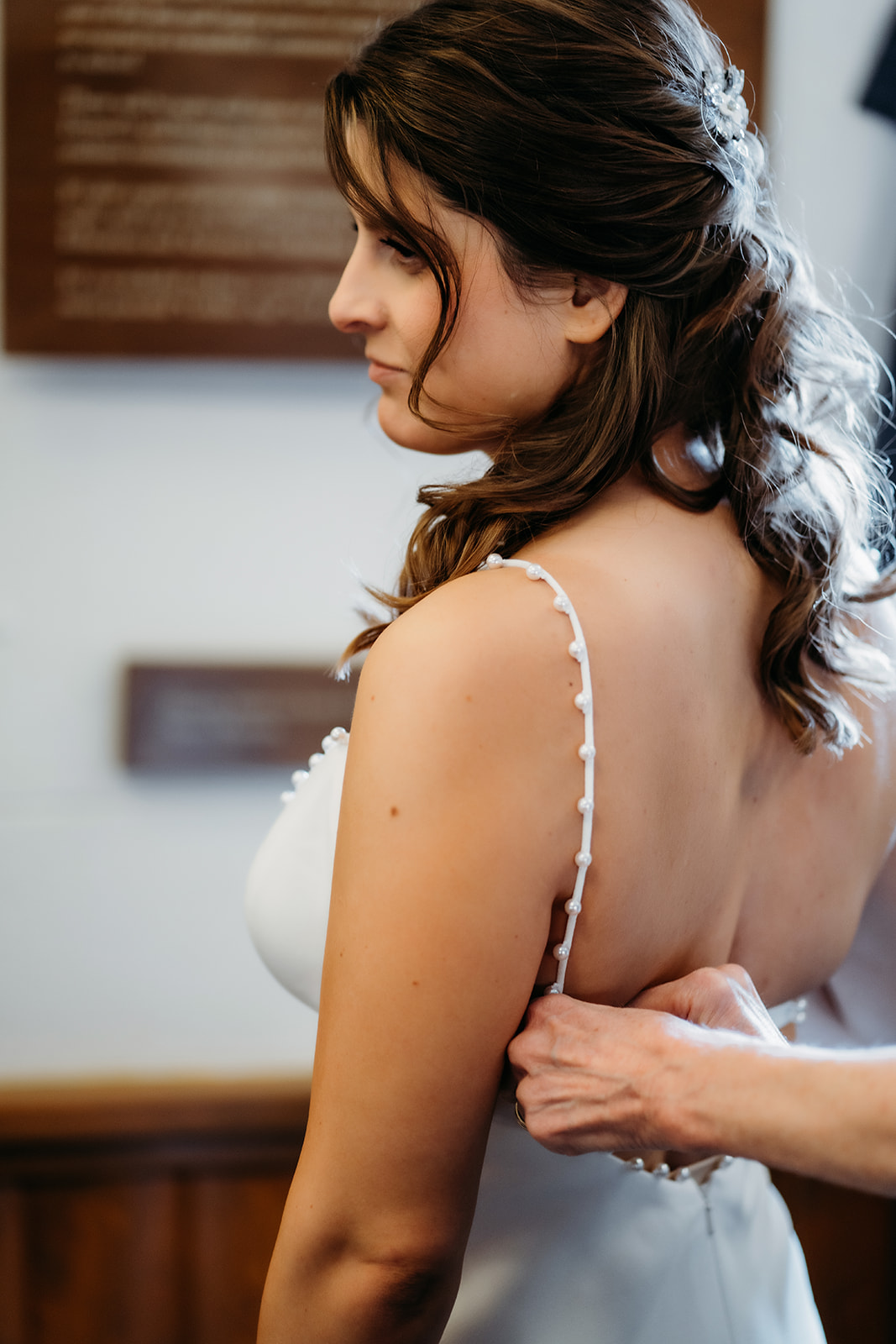 Bride prepares for her big day inside Eisenhower Chapel, showcasing quiet, emotional moments of a small wedding in Colorado.