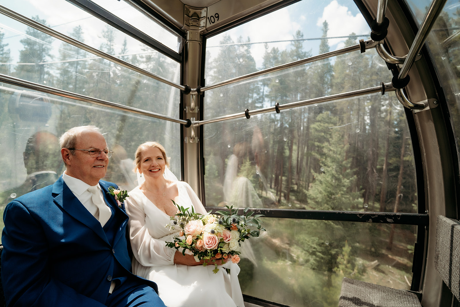 A joyful moment as the couple shares laughter and sunshine during a gondola ride—celebrating How to Make Your Elopement Special with adventure and joy.