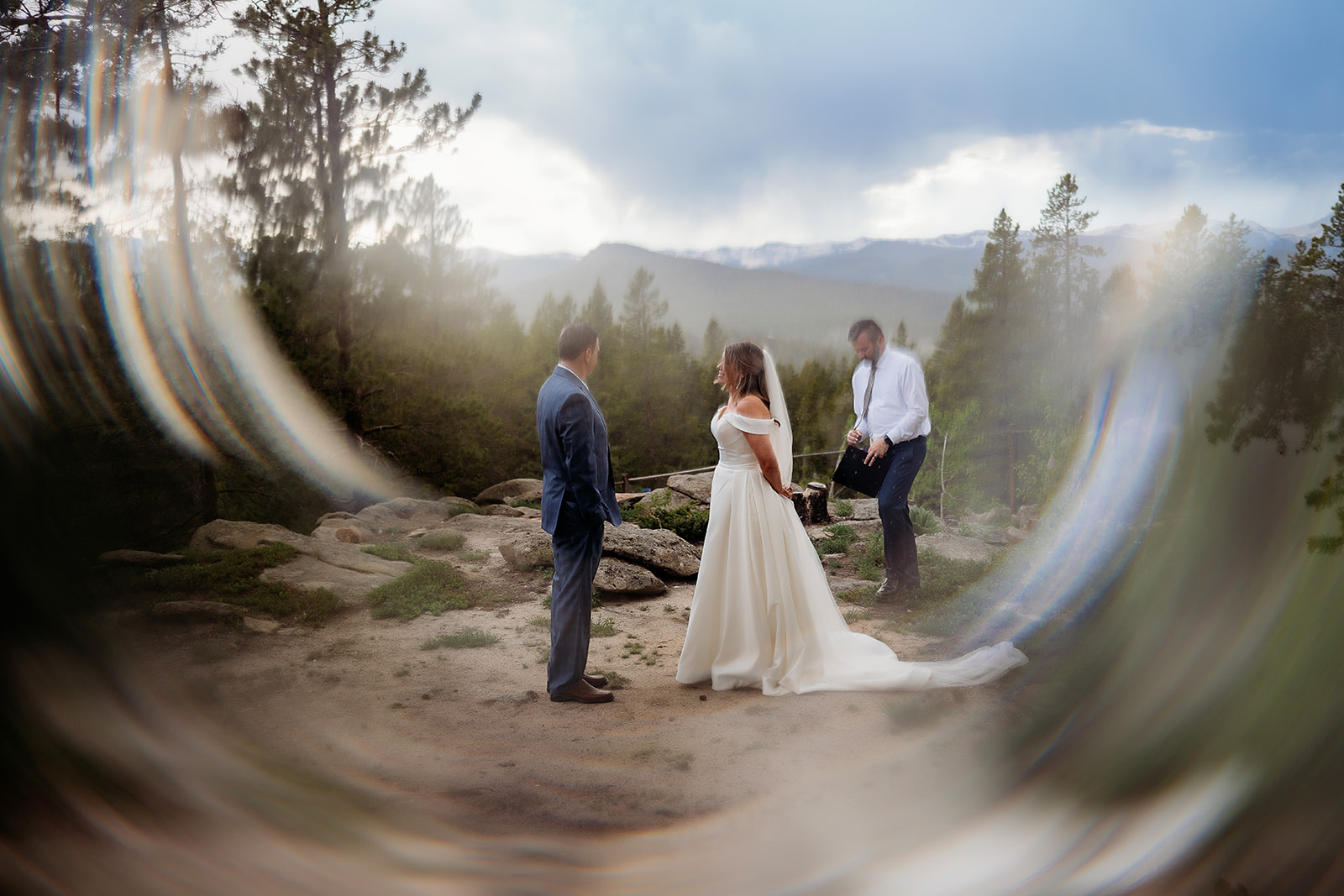 Bride and groom standing in front of one another before intimate forest ceremony begins