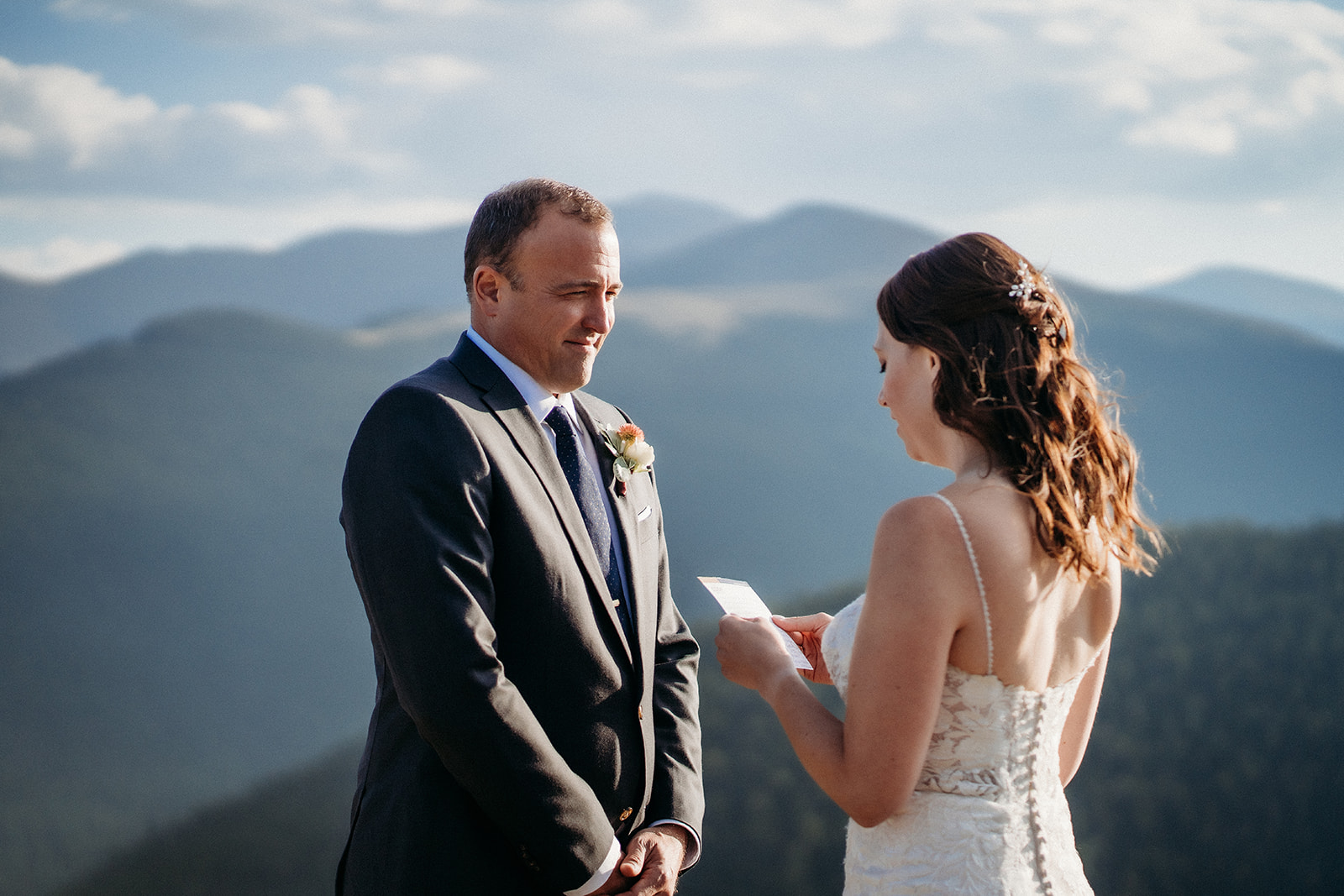 Her eyes stay locked on him while reading vows—one of the most heartfelt moments from their elopement in Colorado.