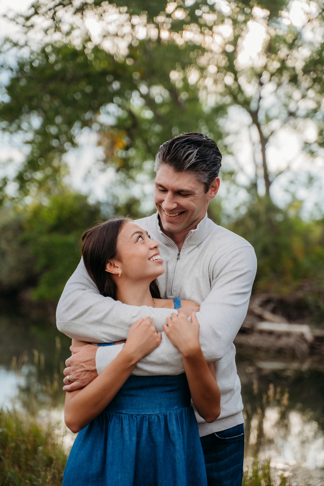 This sweet father-daughter moment captures the joy and closeness that makes family outdoor pictures so meaningful.