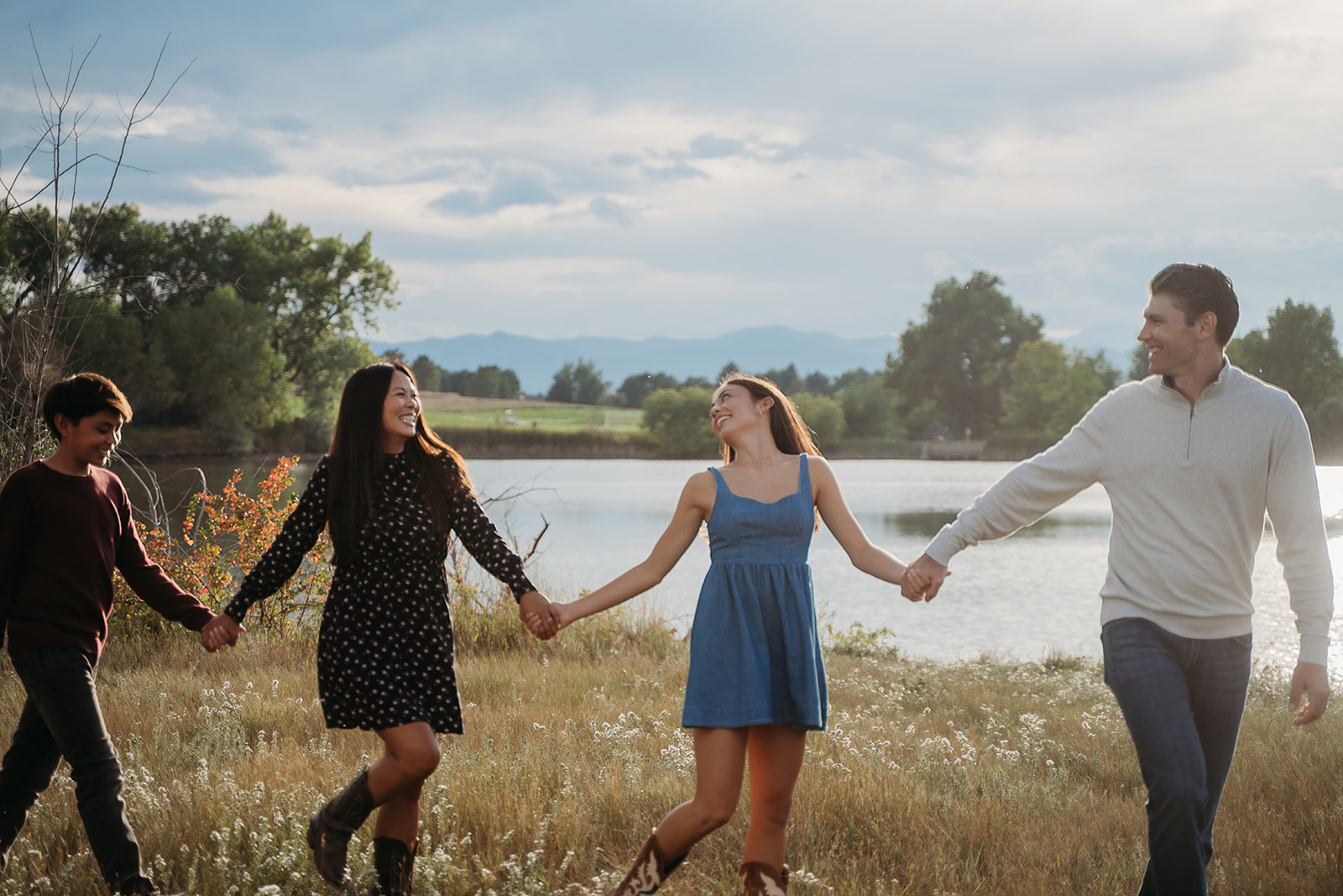 Holding hands by the lake, their laughter says everything—these are the kinds of family outdoor pictures that feel like pure joy.