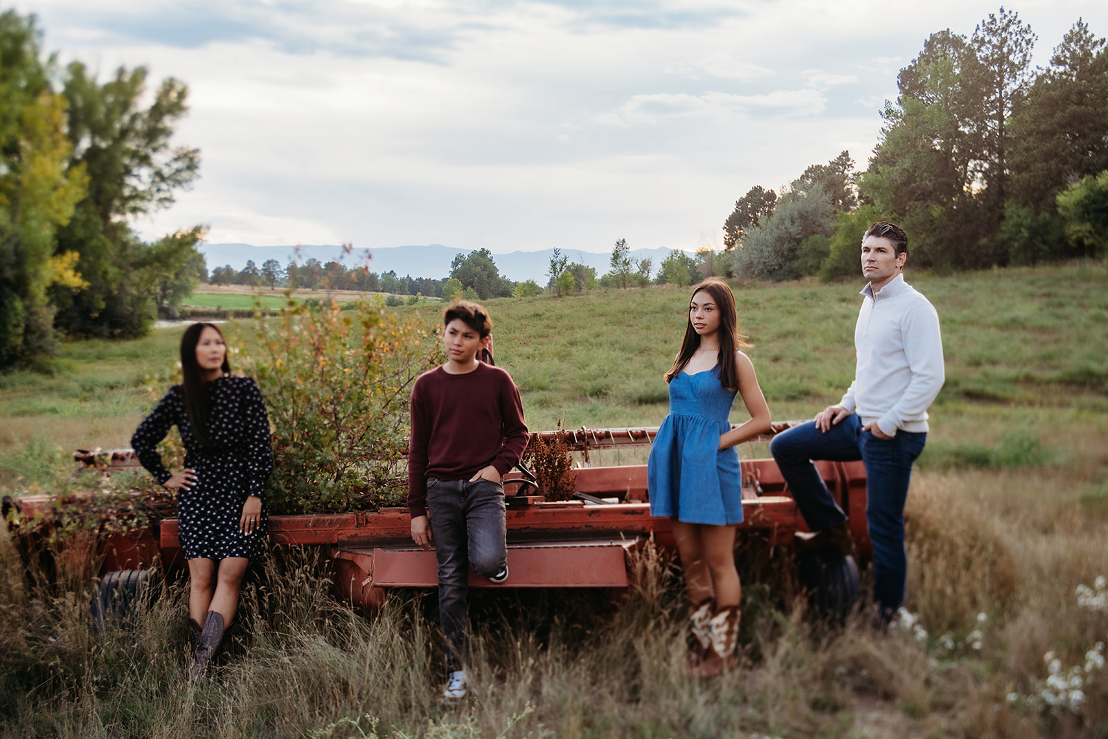 Everyone lined up, hand in hand, in front of silvery-green foliage—one of those timeless family outdoor pictures that feels like a memory already