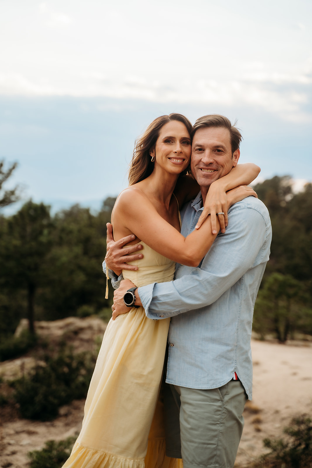 Couple embracing during their family session, a reminder that great family photo tips include capturing parents, too.
