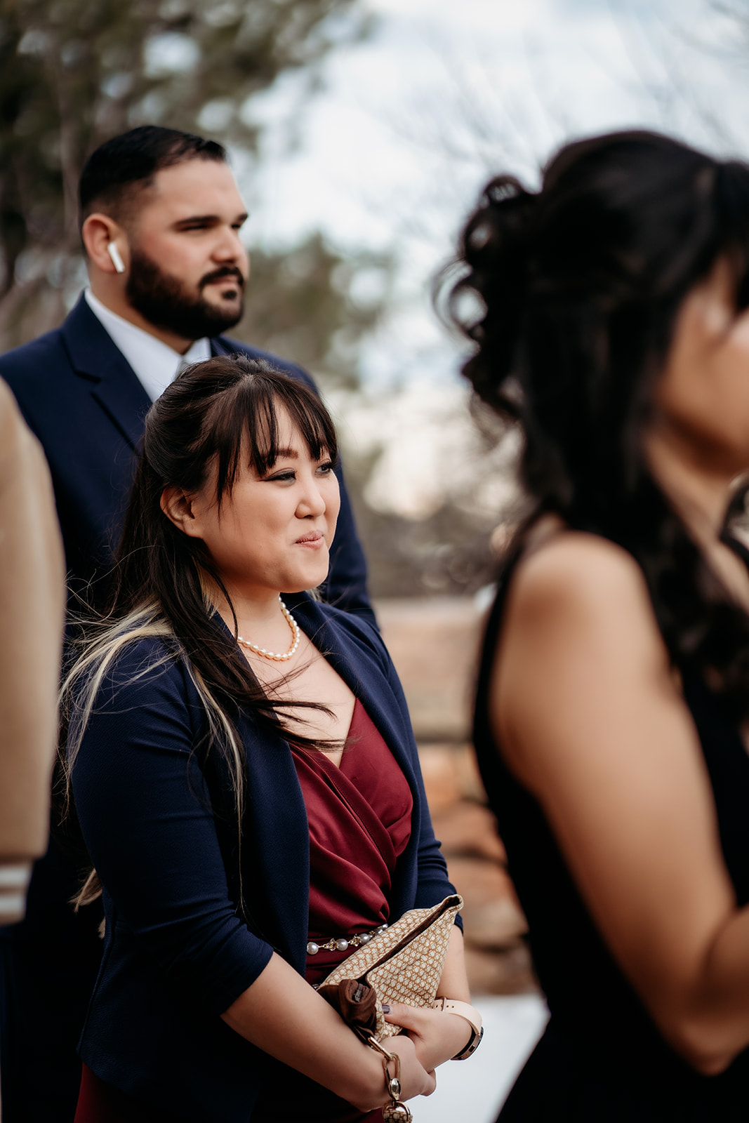 Wedding guests bundled up for an outdoor ceremony in the Colorado mountains.